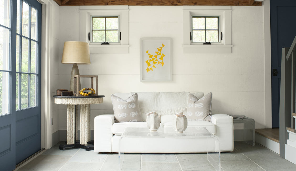 Family room with Benjamin Moore Simply White walls, door in Wolf Gray, and trim in Moonlight White