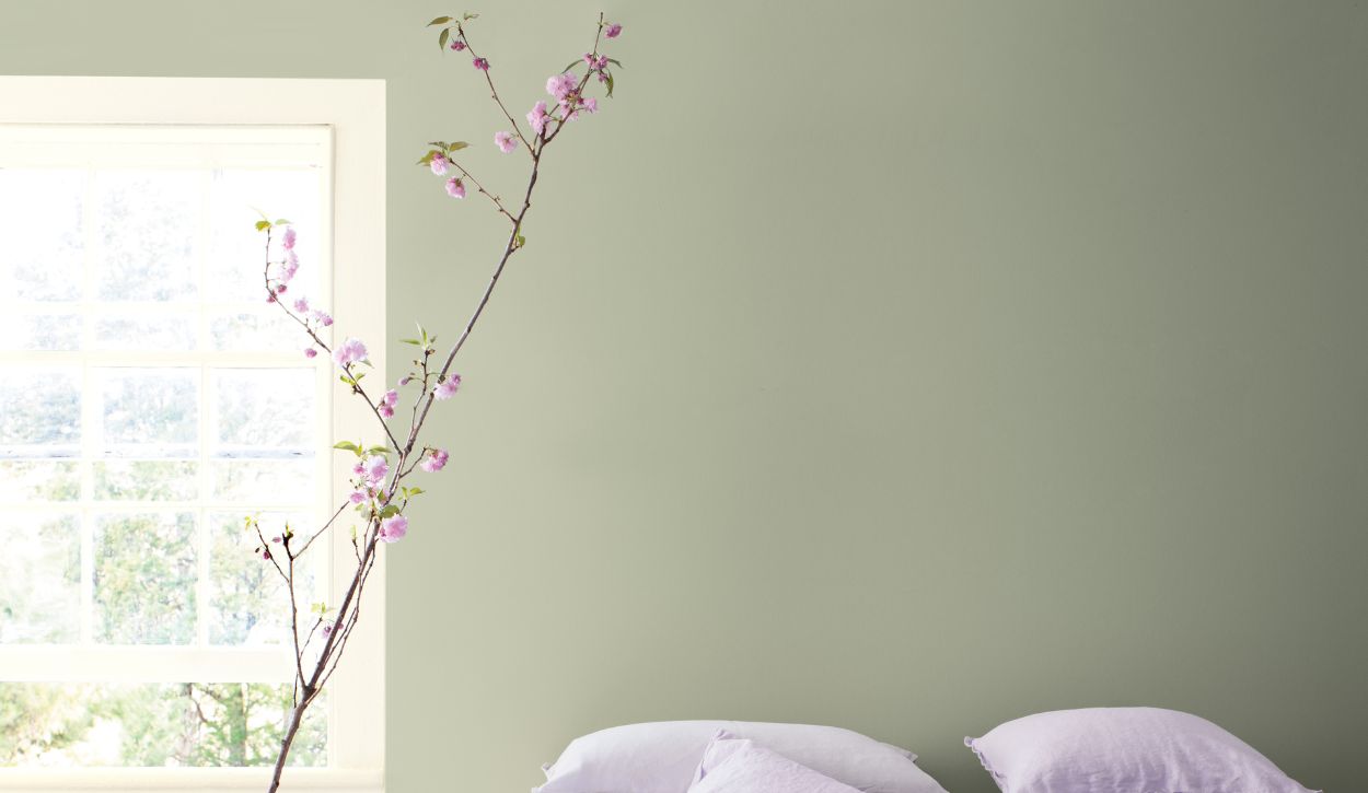 Interior bedroom wall painted in Benjamin Moore October Mist 1495