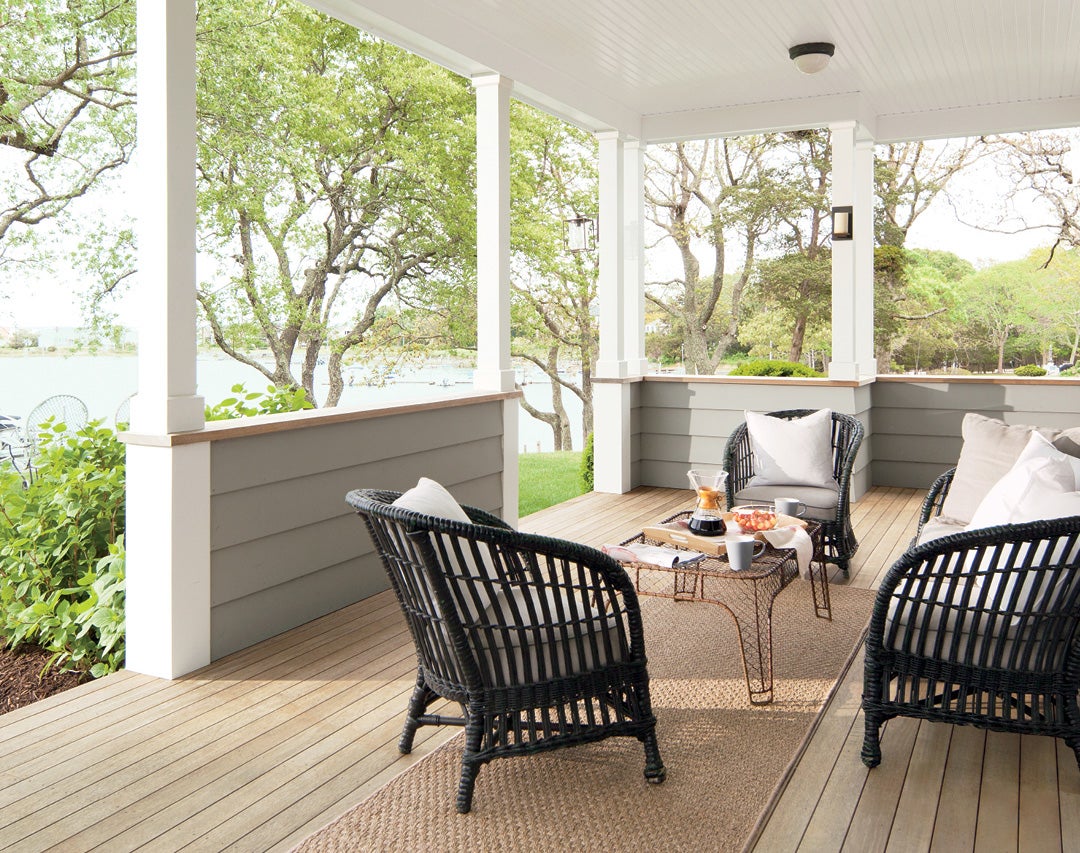 Deck and railings stained in Arborcoat Translucent Classic Oil Stain Silver Gray; siding painted in Benjamin Moore exterior paint Coventry Gray; trim painted in Wisp White 